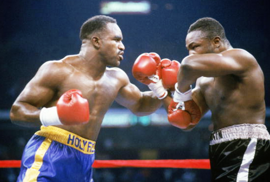 Cooper (right) had proved himself against Holyfield. 
