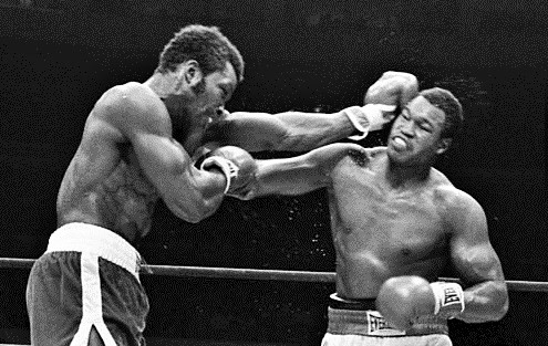 Weaver battles Holmes in 1979. 