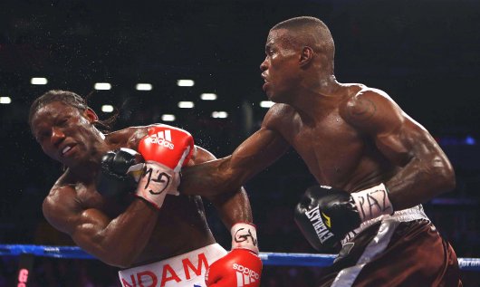 Quillin (right) winning the title from Hassan N'Dam in 2012.