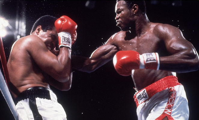 An aged Ali takes a pounding from Larry Holmes.