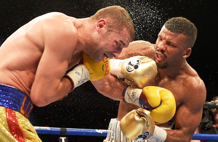 Badou Jack, right, fights Lucian Bute during a boxing match, Sunday, May 1, 2016, in Washington. The match ended in a draw. (AP Photo/Nick Wass)