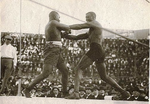Wills (right) battling the great Sam Langford. 
