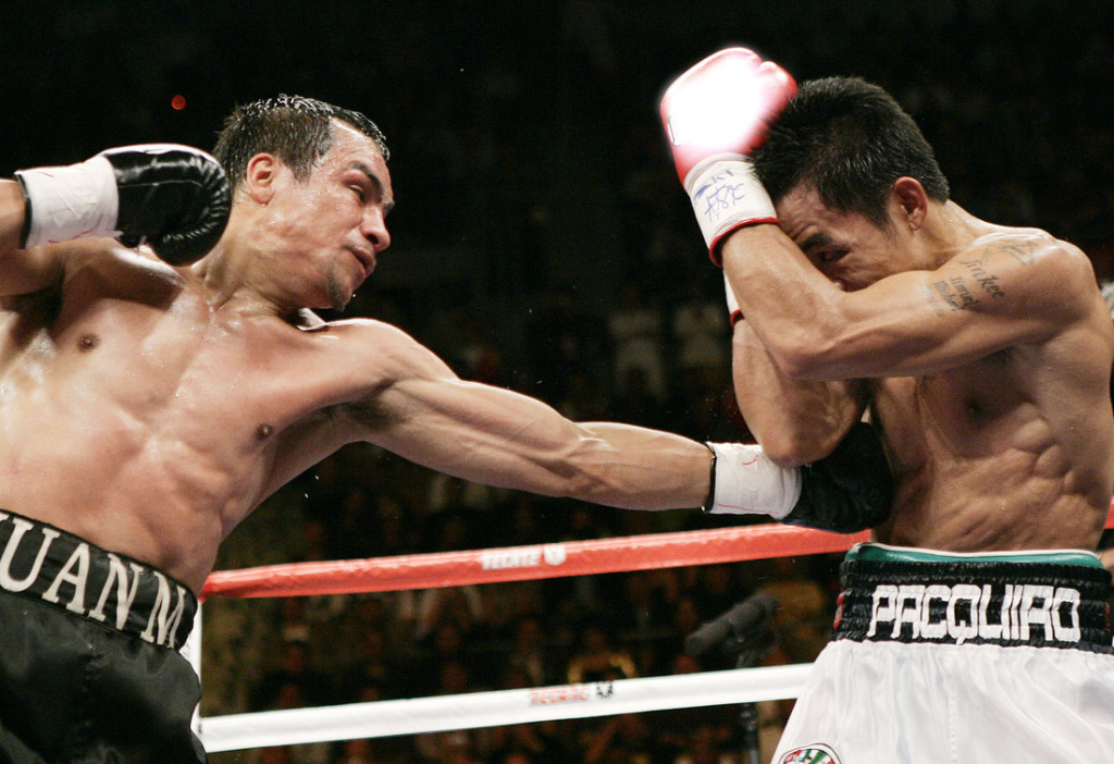 Mandalay Bay Events Center, Las Vegas, NV 03-15-2008 WBC & Ring Magazine Super Featherweight World Title  i30 lbs (12 rds) Manny Pacquiao vs Juan Manuel Marquez Pacquiao wins via split decision (115-112, 114-113 Pacquiao) (115-112 Marquez) referee: Kenny Bayless  Photo credit: WILL HART