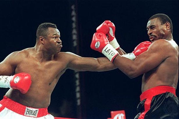 Larry Holmes pontificates in Cut Time.