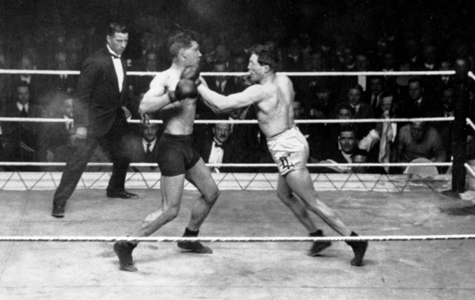 BRIGHTON,SUSSEX - FEBRUARY 16,1922: Ted Kid Lewis (R) lands a left punch against Tom Gummer during the fight at The Dome, ,on February 16,1922 in Brighton, Sussex, United Kingdom. Ted Kid Lewis won by a KO 1. (Photo by: The Ring Magazine/Getty Images)