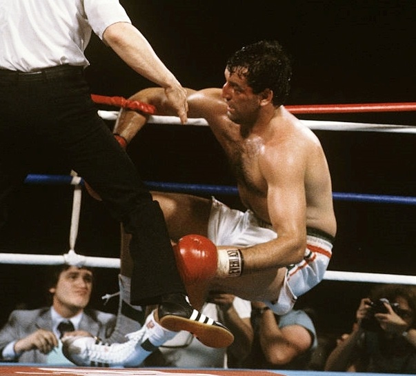 Boxing: WBC Heavyweight Title: Gerry Cooney against the ropes with referee Mills Lane during round 13 knockdown by Larry Holmes at Ceasars Palace. Las Vegas, NV 6/11/1982 CREDIT: Neil Leifer (Photo by Neil Leifer /Sports Illustrated/Getty Images) (Set Number: TC35591 )